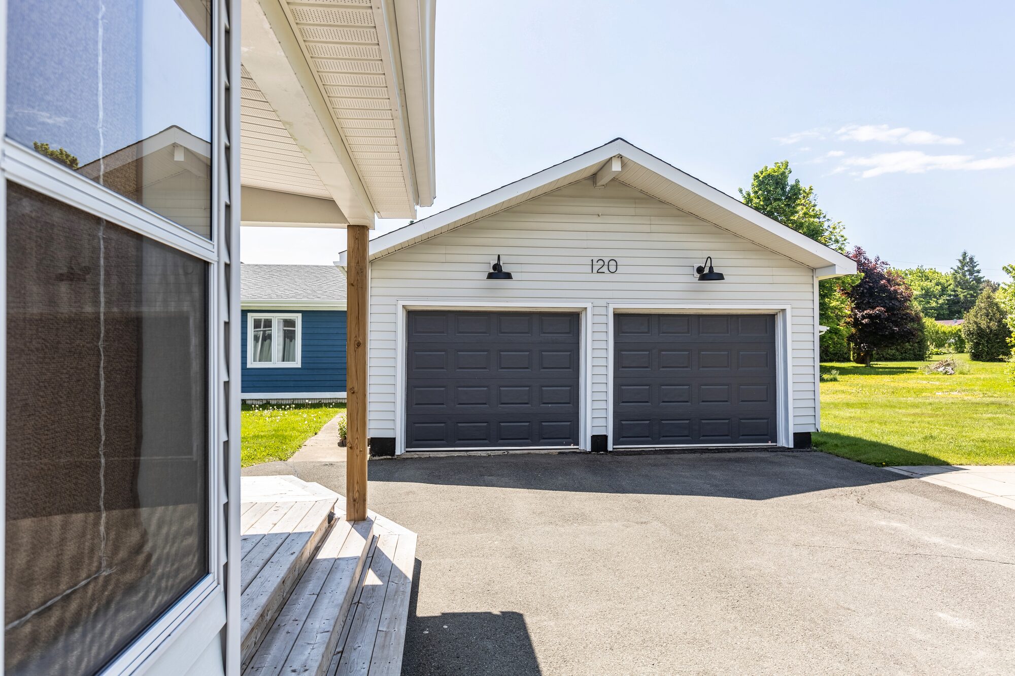 Wide view of the back of the house with the garage and gazebo.